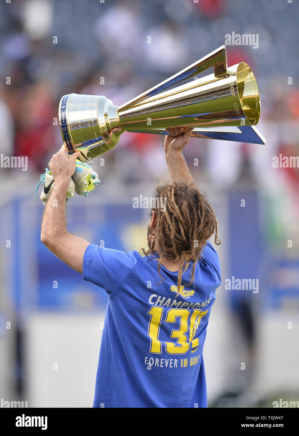 United States' Kyle Beckerman hoists the Gold Cup after defeating Panama in the 2013 CONCACAF Gold Cup Final at Soldier Field in Chicago on July 28, 2013. The United States won 1-0.     UPI/Brian Kersey Stock Photo