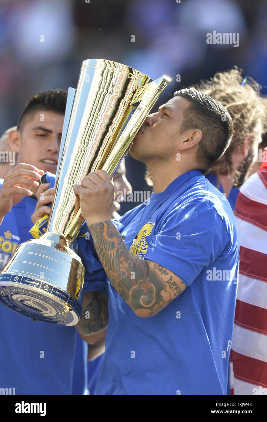 United States goalkeeper Nick Rimando kisses the Gold Cup after defeating Panama in the 2013 CONCACAF Gold Cup Final at Soldier Field in Chicago on July 28, 2013. The United States won 1-0.     UPI/Brian Kersey Stock Photo