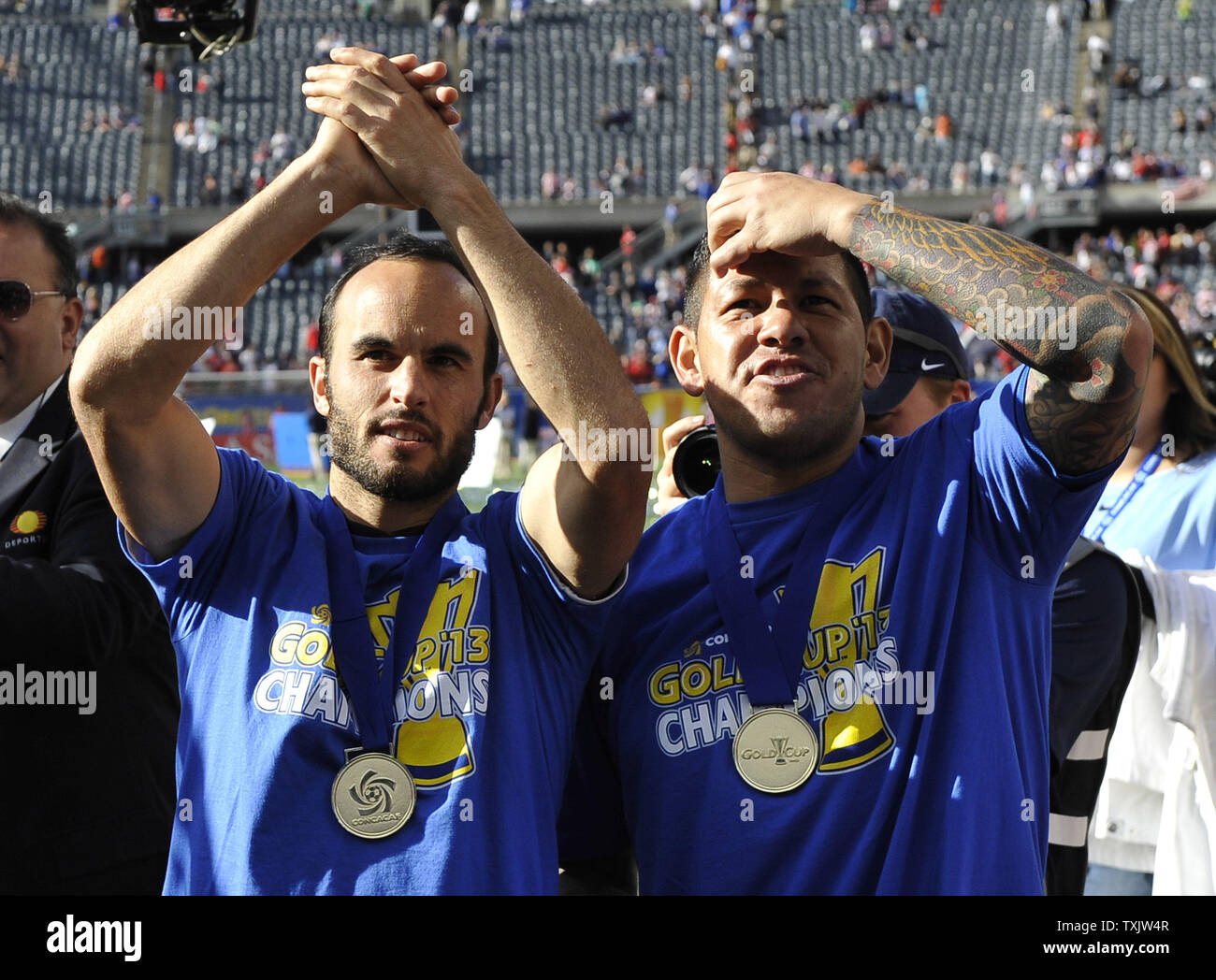 United States' Landon Donovan (L) and Nick Rimando celebrate after defeating Panama in the 2013 CONCACAF Gold Cup Final at Soldier Field in Chicago on July 28, 2013. The United States won 1-0.     UPI/Brian Kersey Stock Photo