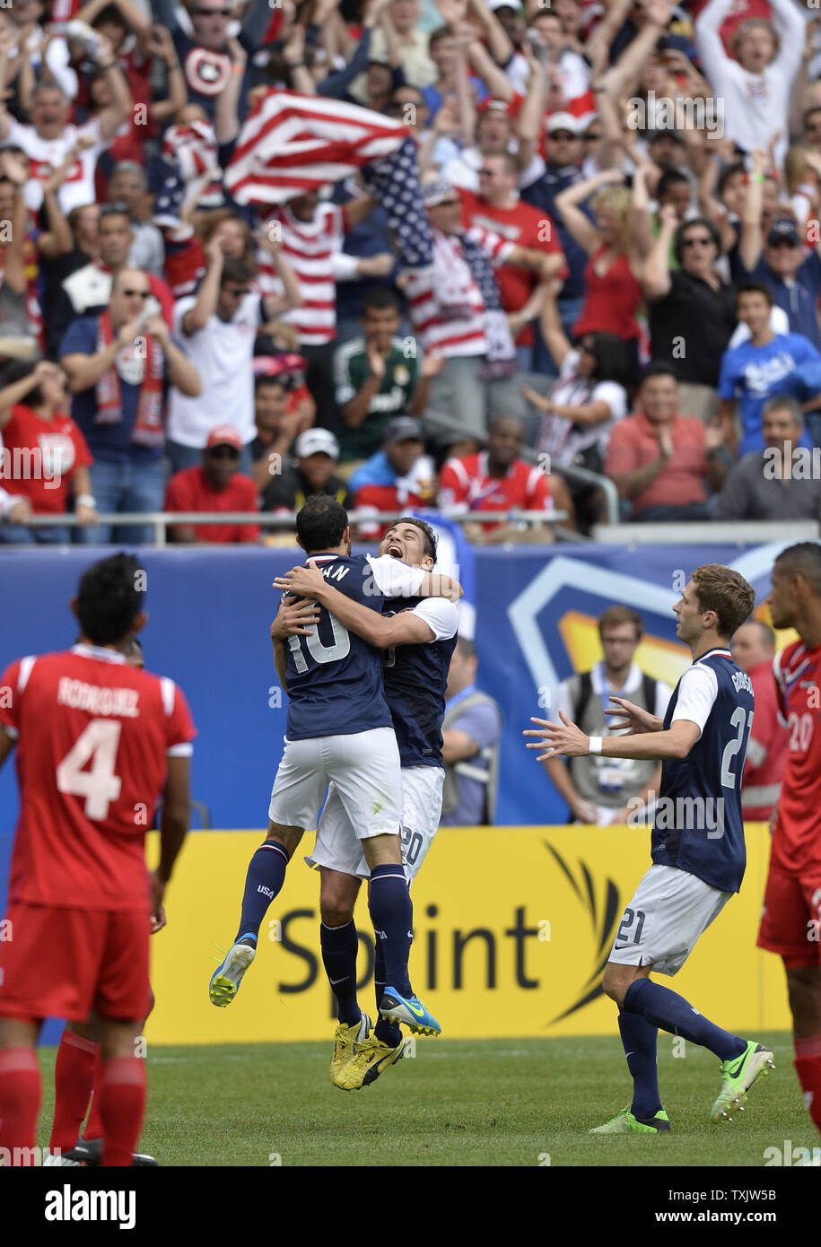United States forward Landon Donovan (L) and midfielder Alejandro Bedoya celebrate midfielder Brek Shea's goal during the second half of the 2013 CONCACAF Gold Cup Final at Soldier Field in Chicago on July 28, 2013. The United States won 1-0.     UPI/Brian Kersey Stock Photo