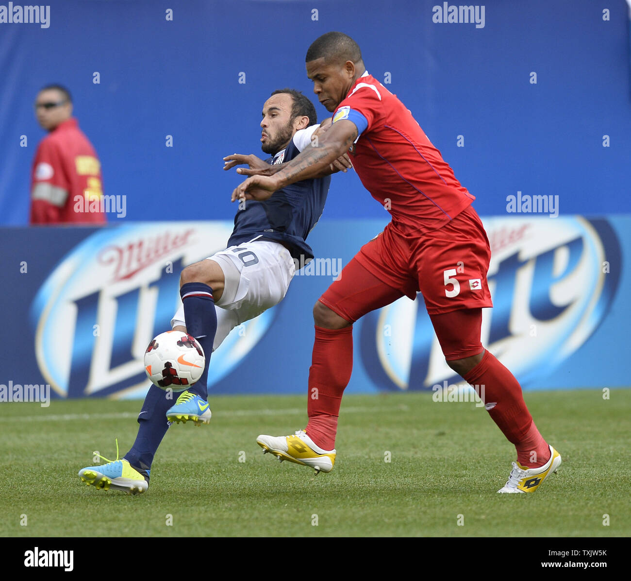 Panama defender Roman Torres (R) takse down United States forward Landon Donovan during the second half of the 2013 CONCACAF Gold Cup Final at Soldier Field in Chicago on July 28, 2013. The United States won 1-0.     UPI/Brian Kersey Stock Photo