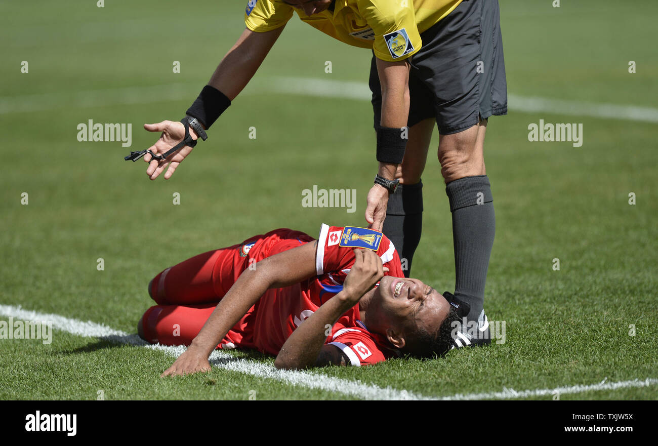 The referee implores for Panama forward Gabriel Torres to move himself out of the field of play during the first half of the 2013 CONCACAF Gold Cup Final against the United States at Soldier Field in Chicago on July 28, 2013. The United States won 1-0.     UPI/Brian Kersey Stock Photo