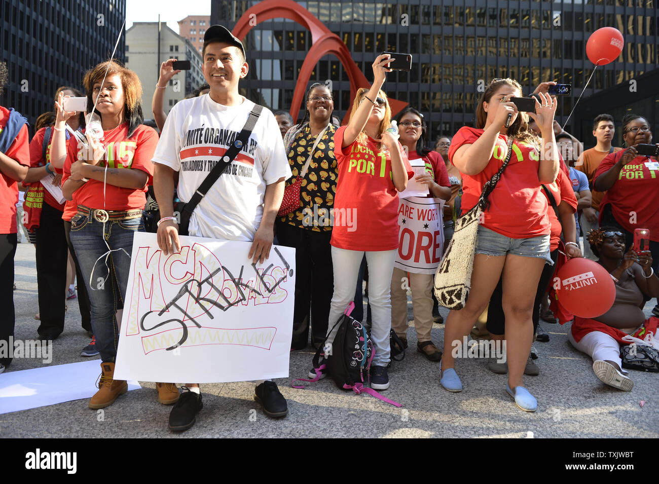 Protesters rally in support of striking fast food workers, who walked off the job in nearly 60 cities, at Federal Plaza in Chicago on August 29, 2013.  Strikers are calling for an increase in the Federal minimum wage from $7.25 to $15 per hour.     UPI/Brian Kersey Stock Photo