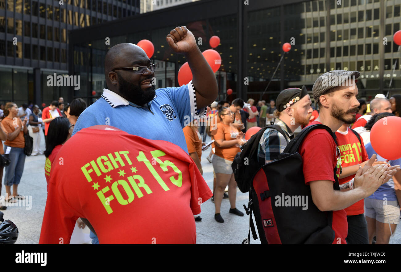 Elmer Head (L) yells at a rally in support of striking fast food workers, who walked off the job in nearly 60 cities, at Federal Plaza in Chicago on August 29, 2013.  Strikers are calling for an increase in the Federal minimum wage from $7.25 to $15 per hour.     UPI/Brian Kersey Stock Photo