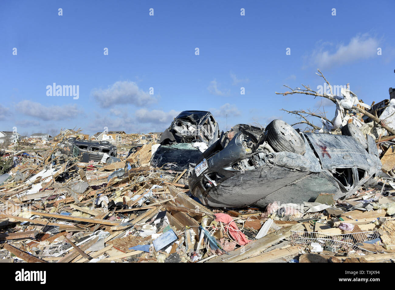 Cars rest where they were thrown by a tornado in Washington, Illinois on November 18, 2013. Six people died and hundreds of homes were destroyed in Illinois as 81 tornadoes were sighted on November 17 throughout 12 midwest states including the EF4 tornado that struck Washington, Illinois.     UPI/Brian Kersey.     UPI/Brian Kersey Stock Photo