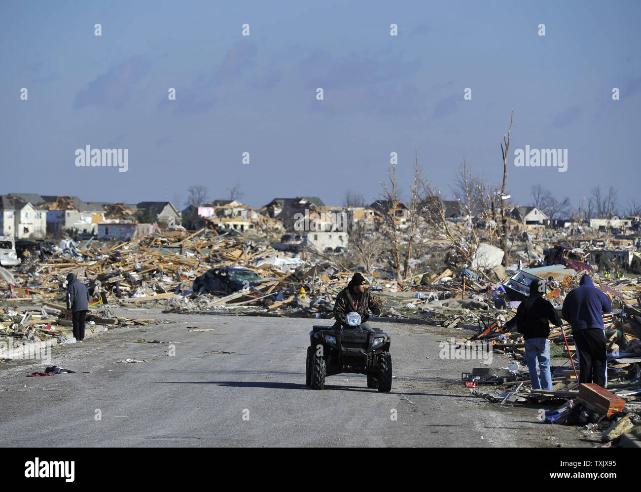 Residents sort through what is left of their homes in Washington, Illinois on November 18, 2013. Six people died and hundreds of homes were destroyed in Illinois as 81 tornadoes were sighted on November 17 throughout 12 midwest states including the EF4 tornado that struck Washington, Illinois.     UPI/Brian Kersey.     UPI/Brian Kersey Stock Photo