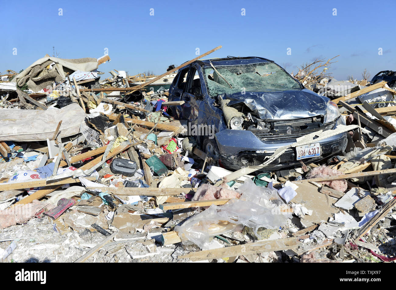 A car rests where they it was thrown by a tornado in Washington, Illinois on November 18, 2013. Six people died and hundreds of homes were destroyed in Illinois as 81 tornadoes were sighted on November 17 throughout 12 midwest states including the EF4 tornado that struck Washington, Illinois.     UPI/Brian Kersey.     UPI/Brian Kersey Stock Photo