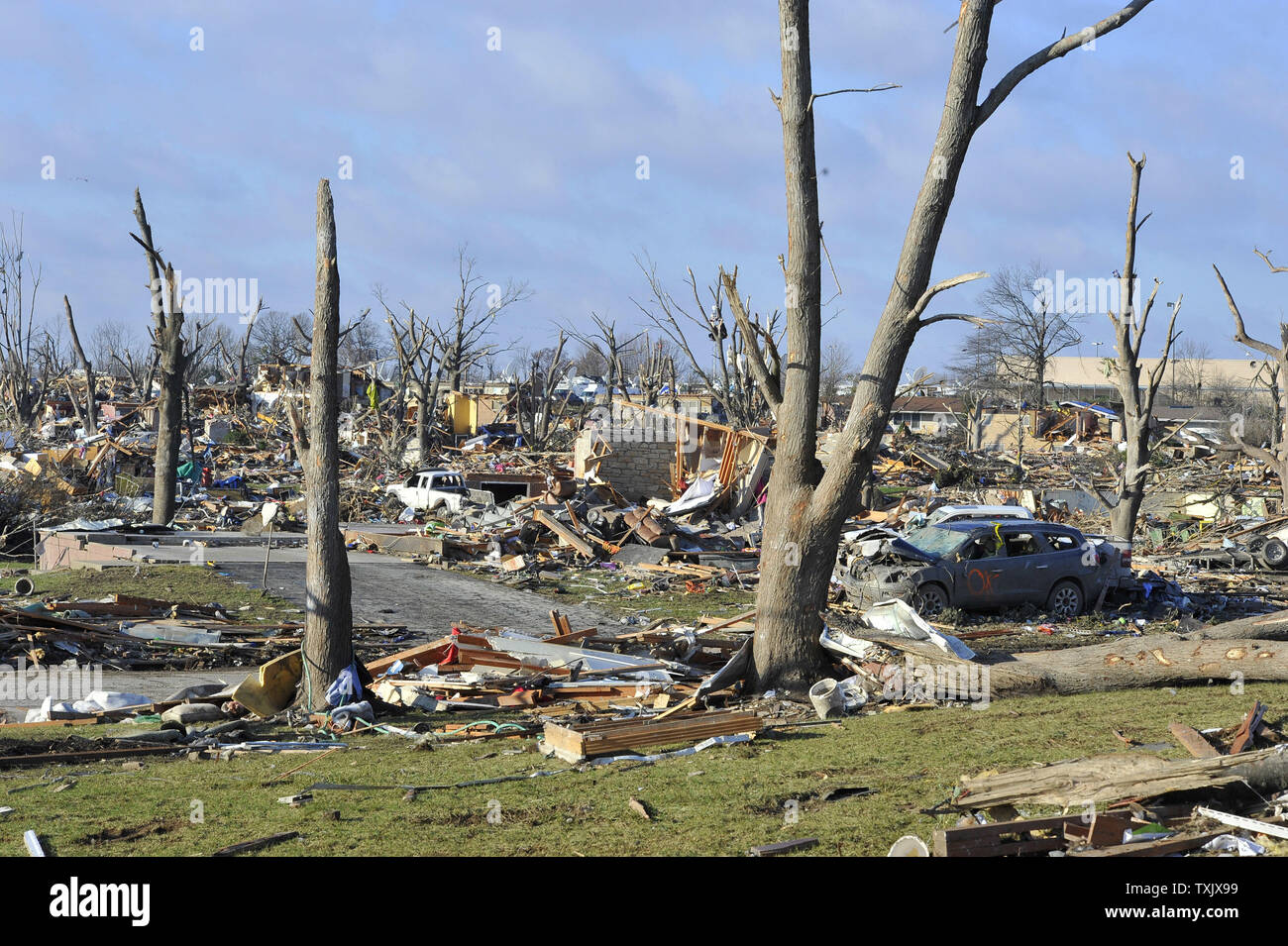 Trees stand amid the devastation of an EF4 tornado in Washington, Illinois on November 18, 2013. Six people died and hundreds of homes were destroyed in Illinois as 81 tornadoes were sighted on November 17 throughout 12 midwest states including the tornado that struck Washington, Illinois.     UPI/Brian Kersey.     UPI/Brian Kersey Stock Photo