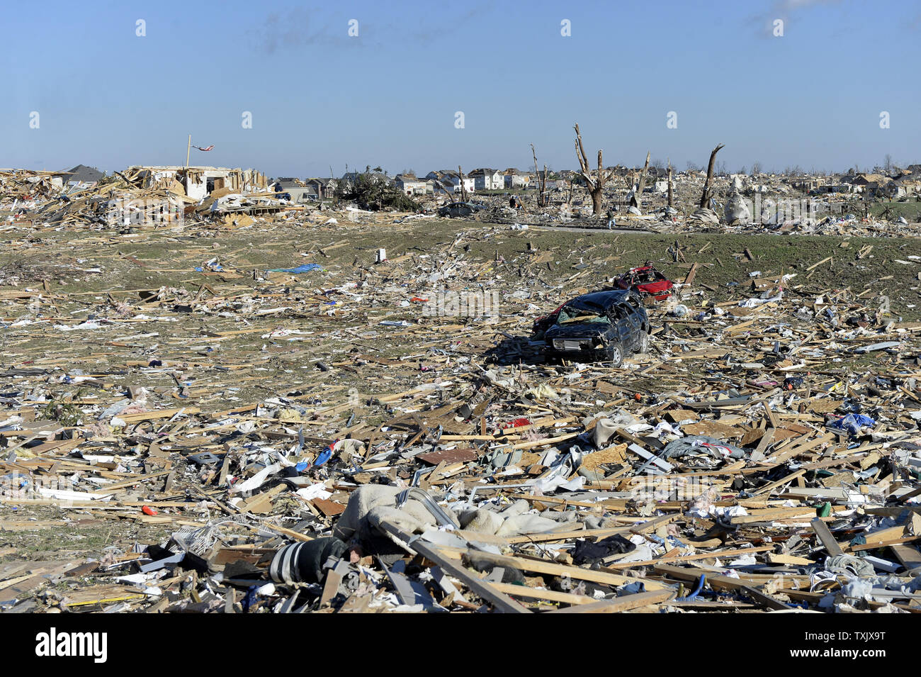 An open field is filled with debris following a tornado in Washington, Illinois on November 18, 2013. Six people died and hundreds of homes were destroyed in Illinois as 81 tornadoes were sighted on November 17 throughout 12 midwest states including the EF4 tornado that struck Washington, Illinois.     UPI/Brian Kersey.     UPI/Brian Kersey Stock Photo