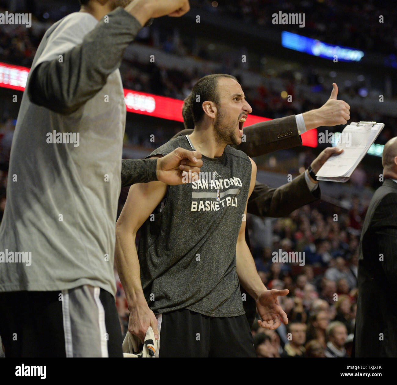 San Antonio Spurs guard Manu Ginobili cheers from the bench during the fourth quarter against the Chicago Bulls at the United Center in Chicago on March 11, 2014. The Spurs defeated the Bulls 104-96.     UPI/Brian Kersey Stock Photo