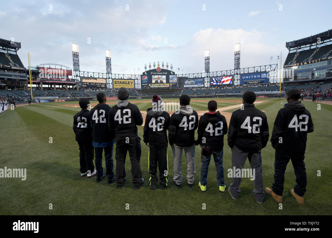 A group of local youth baseball players wear number 42 in honor of Jackie Robinson before the Boston Red Sox Chicago White Sox game at U.S. Cellular Field on April 15, 2014 in Chicago. All players wore number 42 in honor of Robinson.     UPI/Brian Kersey Stock Photo