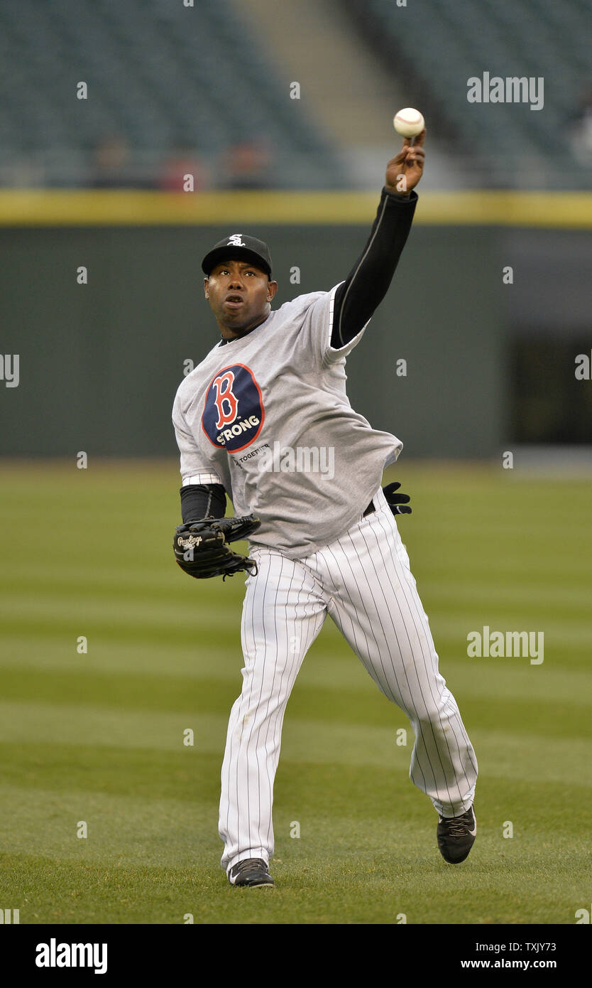 Chicago White Sox left fielder Alejandro De Aza wears a Boston Strong tee  shirt as he warms up before the game against the Boston Red Sox at U.S.  Cellular Field on April