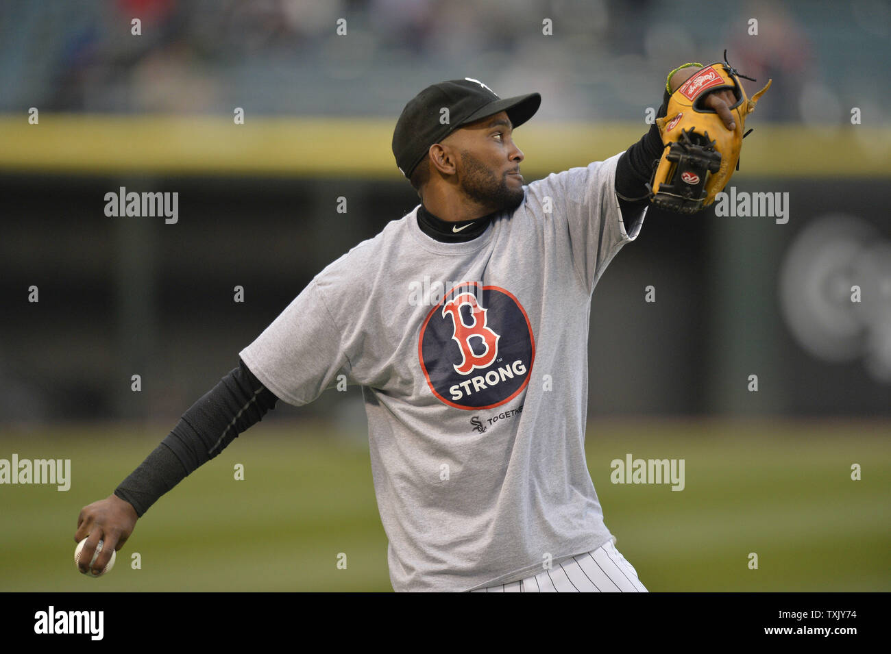 Chicago White Sox shortstop Alexei Ramirez wears a Boston Strong tee shirt  as he warms up before the game against the Boston Red Sox at U.S. Cellular  Field on April 15, 2014