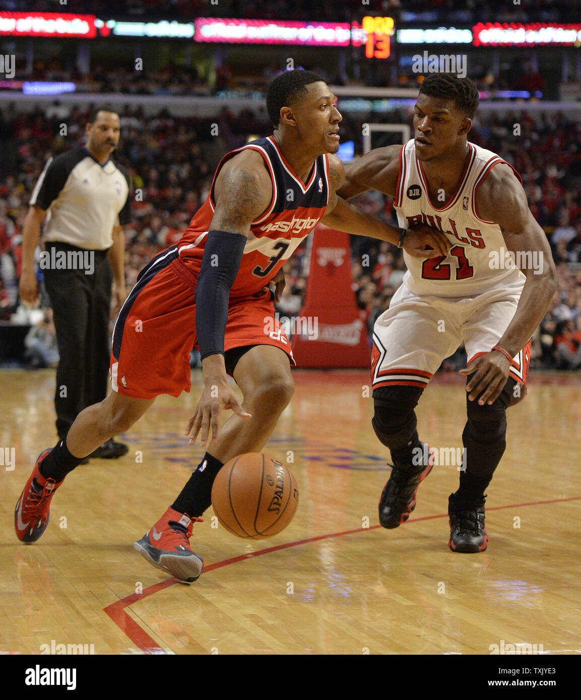 Washington Wizards guard Bradley Beal (L) drives on Chicago Bulls guard Jimmy Butler during the third quarter of Game 2 of the NBA Eastern Conference quarterfinals at the United Center on April 22, 2014 in Chicago. The Wizards defeated the Bulls 101-99 in overtime and lead the best of seven series 2-0.     UPI/Brian Kersey Stock Photo