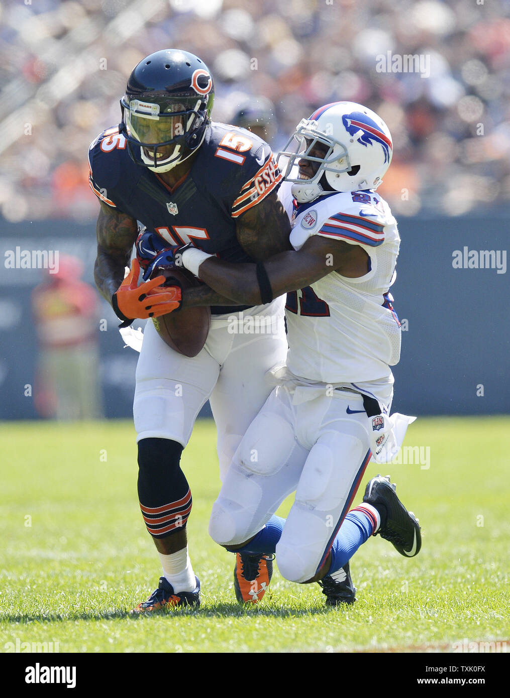 Buffalo Bills cornerback Leodis McKelvin (R) strips the ball from Chicago Bears wide receiver Brandon Marshall during the second quarter at Soldier Field on September 7, 2014 in Chicago. The Bills recovered the fumble.     UPI/Brian Kersey Stock Photo