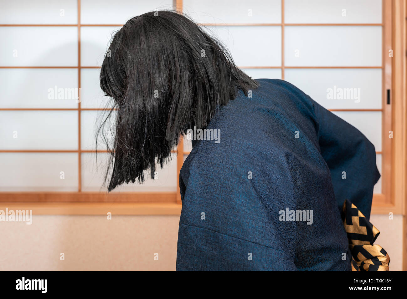 Traditional japanese sliding paper door window with man in kimono costume doing martial arts with black hair Stock Photo - Alamy Traditional japanese sliding paper door window with man in kimono costume doing martial arts with black hair Stock Photo - Alamy