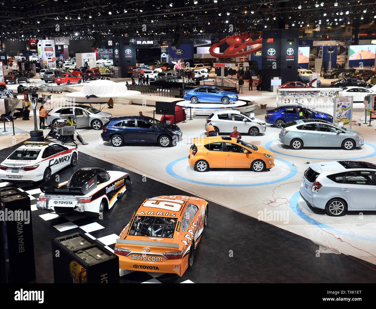 Workers prepare the floor for the Chicago Auto Show on February 11 ...