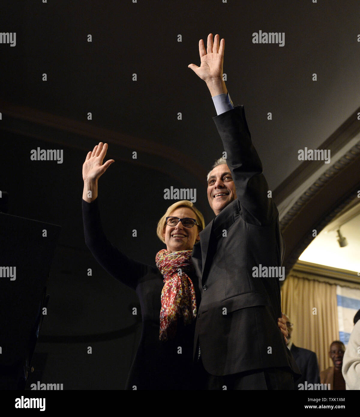Chicago Mayor Rahm Emanuel (R) and his wife Amy Rule wave to supporters at a rally at the Plumbers Local Union 130 hall following the mayoral run-off election in Chicago on April 7, 2015. Emanuel defeated opponent Jesus 'Chuy' Garcia in the first runoff since Chicago switched to non-partisan elections 20 years ago.       Photo by Brian Kersey/UPI Stock Photo