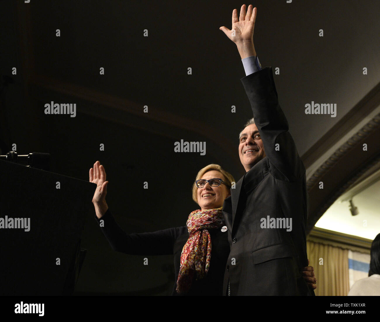 Chicago Mayor Rahm Emanuel (R) and his wife Amy Rule wave to supporters at a rally at the Plumbers Local Union 130 hall following the mayoral run-off election in Chicago on April 7, 2015. Emanuel defeated opponent Jesus 'Chuy' Garcia in the first runoff since Chicago switched to non-partisan elections 20 years ago.       Photo by Brian Kersey/UPI Stock Photo