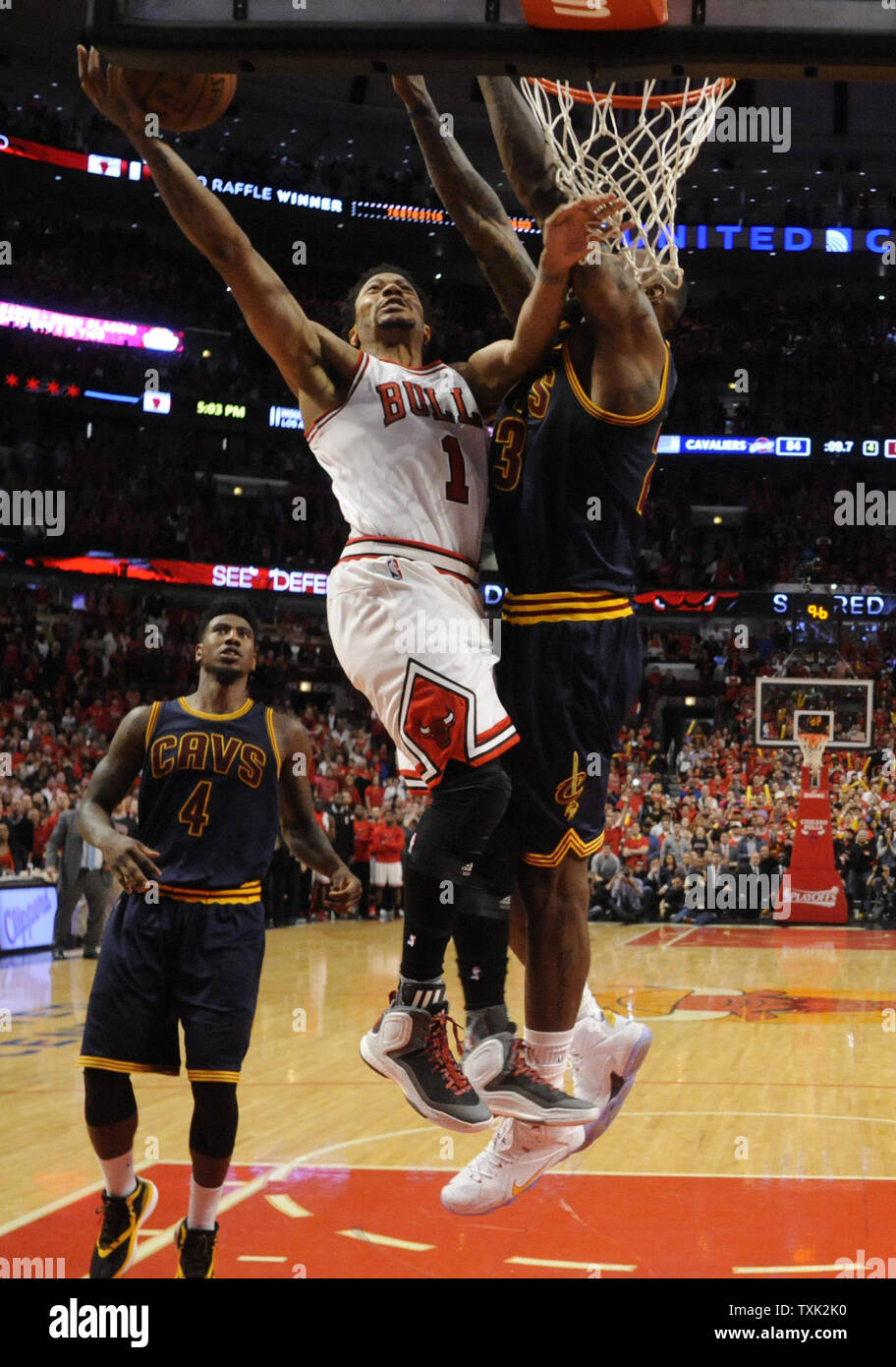 Chicago Bulls guard Derrick Rose (C) drives on Cleveland Cavaliers guard Iman Shumpert (L) and center Tristan Thompson (R) during the second half of game 4 of the Eastern Conference Semifinals of the NBA Playoffs at the United Center on May 10, 2015 in Chicago. The Cavaliers defeated the Bulls 86-84 the series is tied in the best of seven series 2-2.     Photo by David Banks/UPI Stock Photo