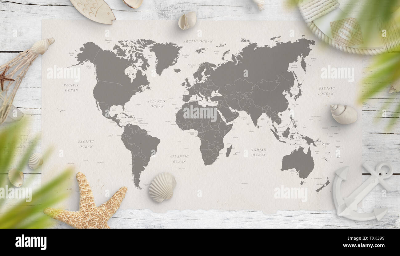 World map surrounded with summer vacation and sea things on wooden table. Travel concept. Flat lay. Stock Photo