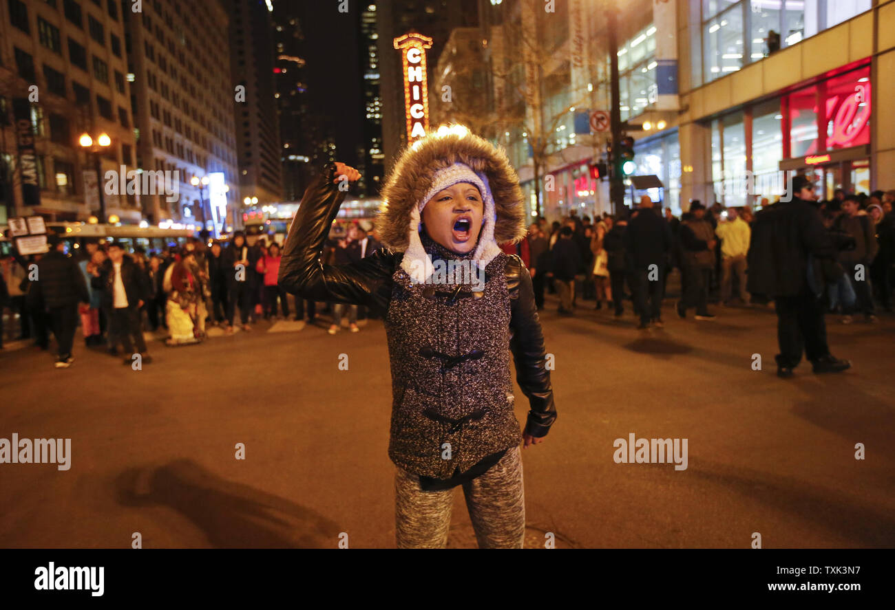 Demonstrators blocking parts of the State Street to protest the 2014 police shooting of Laquan McDonald in Chicago on November 25, 2015. The 17-year old McDonald, who was armed with a small knife fleeing police, was shot 16 times by officer Jason Van Dyke on the night of October 20, 2014. The Chicago Police, in response to a judgeÕs order, released the dash cam video on November 24, the same day that Van Dyke, who had been on desk-duty since the incident, was charged with first-degree murder and fired from the police force. Photo by Kamil Krzaczynski/UPI Stock Photo