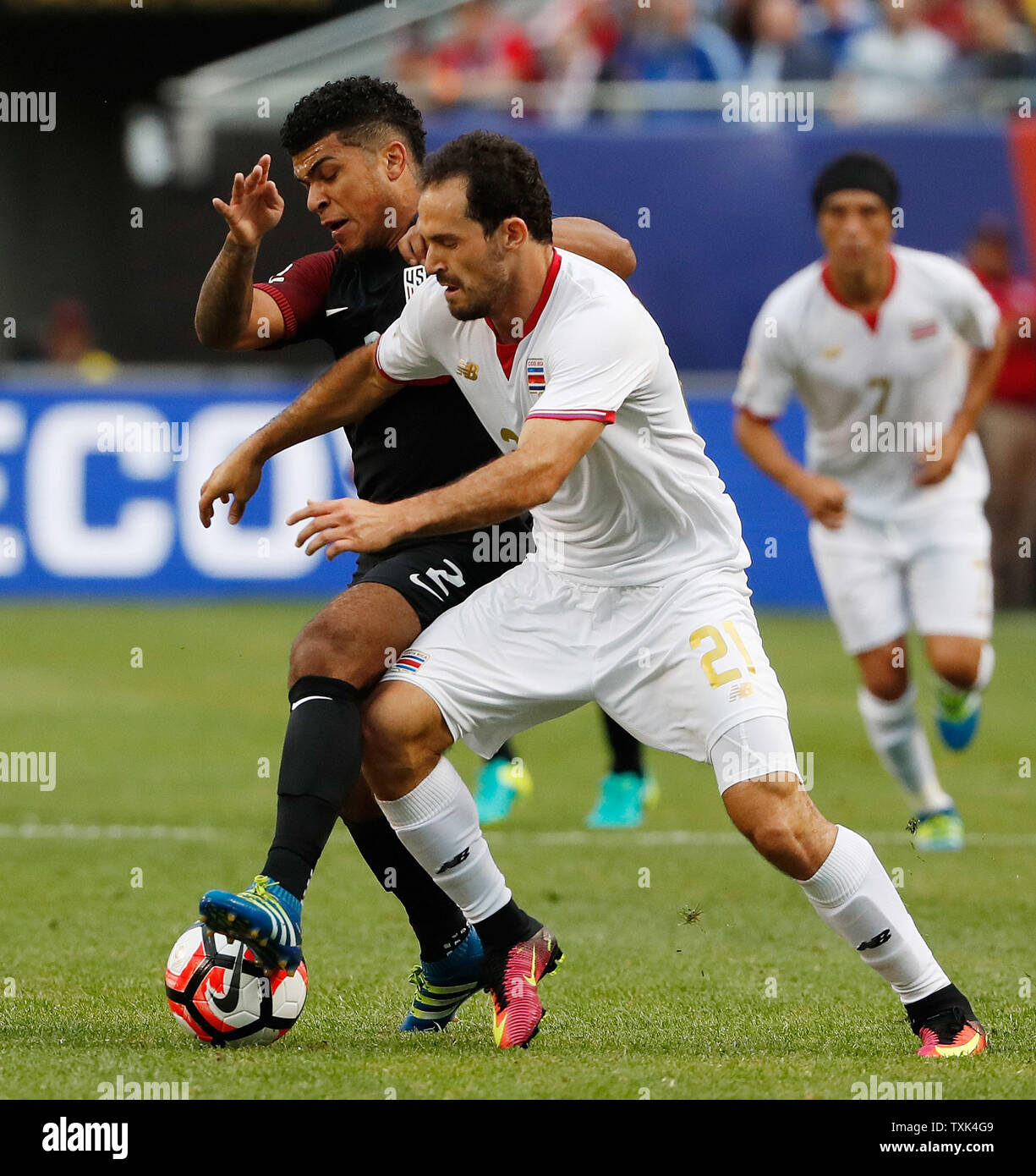 United States defender DeAndre Yedlin (L) and Costa Rica forward Marco Urena fight for control of the ball during the first half of a 2016 Copa America Centenario Group A match at Soldier Field in Chicago on June 7, 2016.     Photo by Brian Kersey/UPI Stock Photo