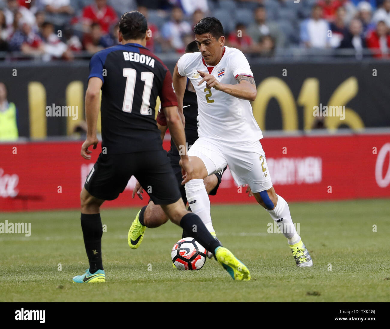 Costa Rica defender Johnny Acosta (R) moves the ball as United States midfielder Alejandro Bedoya defends during the first half of a 2016 Copa America Centenario Group A match at Soldier Field in Chicago on June 7, 2016. The United States defeated Costa Rica 4-0.     Photo by Brian Kersey/UPI Stock Photo