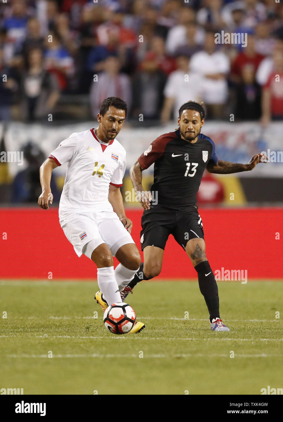 Costa Rica midfielder Randall Azofeifa (L) and United States midfielder Jermaine Jones go for the ball during the first half of a 2016 Copa America Centenario Group A match at Soldier Field in Chicago on June 7, 2016. The United States defeated Costa Rica 4-0.     Photo by Brian Kersey/UPI Stock Photo