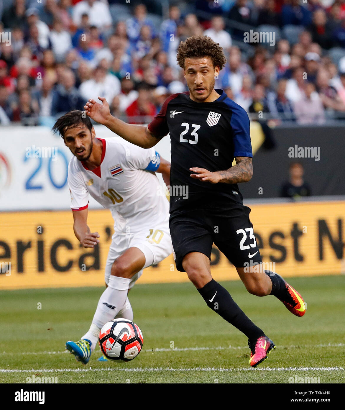 Costa Rica forward Bryan Ruiz (L) and United States defender Fabian Johnson chase the ball during the first half of a 2016 Copa America Centenario Group A match at Soldier Field in Chicago on June 7, 2016. The United States defeated Costa Rica 4-0.     Photo by Brian Kersey/UPI Stock Photo