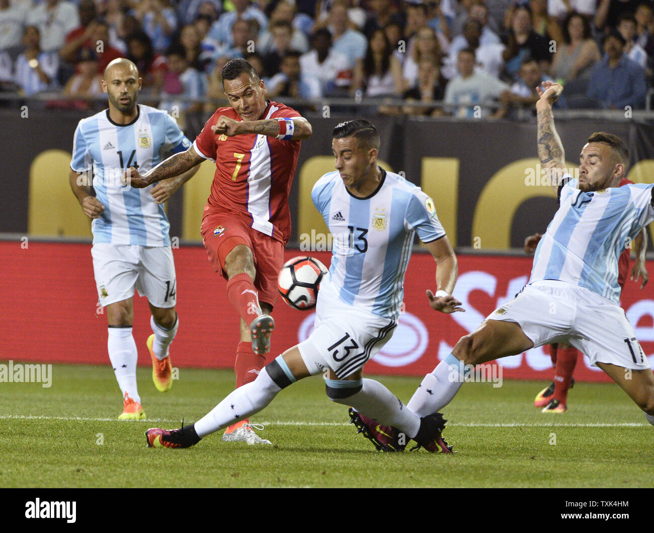 Panama forward Blas Perez (7) shoots as Argentina defender Ramiro Funes Mori (13) and defender Nicolas Otamendi try to block the shot during the first half of a 2016 Copa America Centenario Group D match at Soldier Field in Chicago on June 10, 2016.     Photo by Brian Kersey/UPI Stock Photo