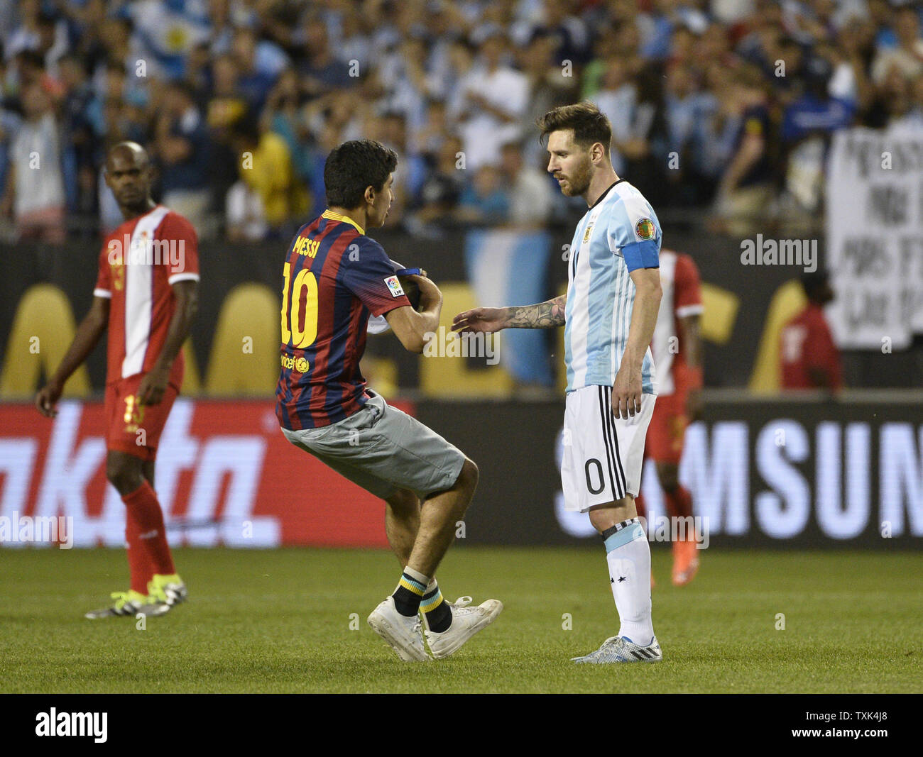 A Fan Approaches Argentina Midfielder Lionel Messi After A 2016