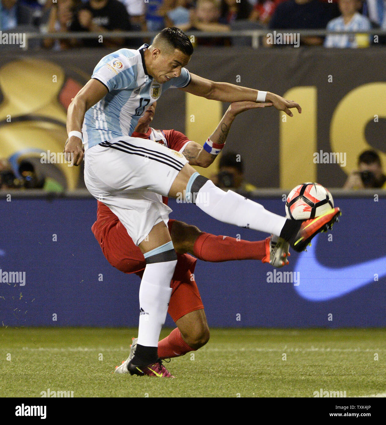 Argentina defender Ramiro Funes Mori (L) and Panama forward Blas Perez go for the ball during the first half of a 2016 Copa America Centenario Group D match at Soldier Field in Chicago on June 10, 2016. Argentina defeated Panama 5-0.     Photo by Brian Kersey/UPI Stock Photo