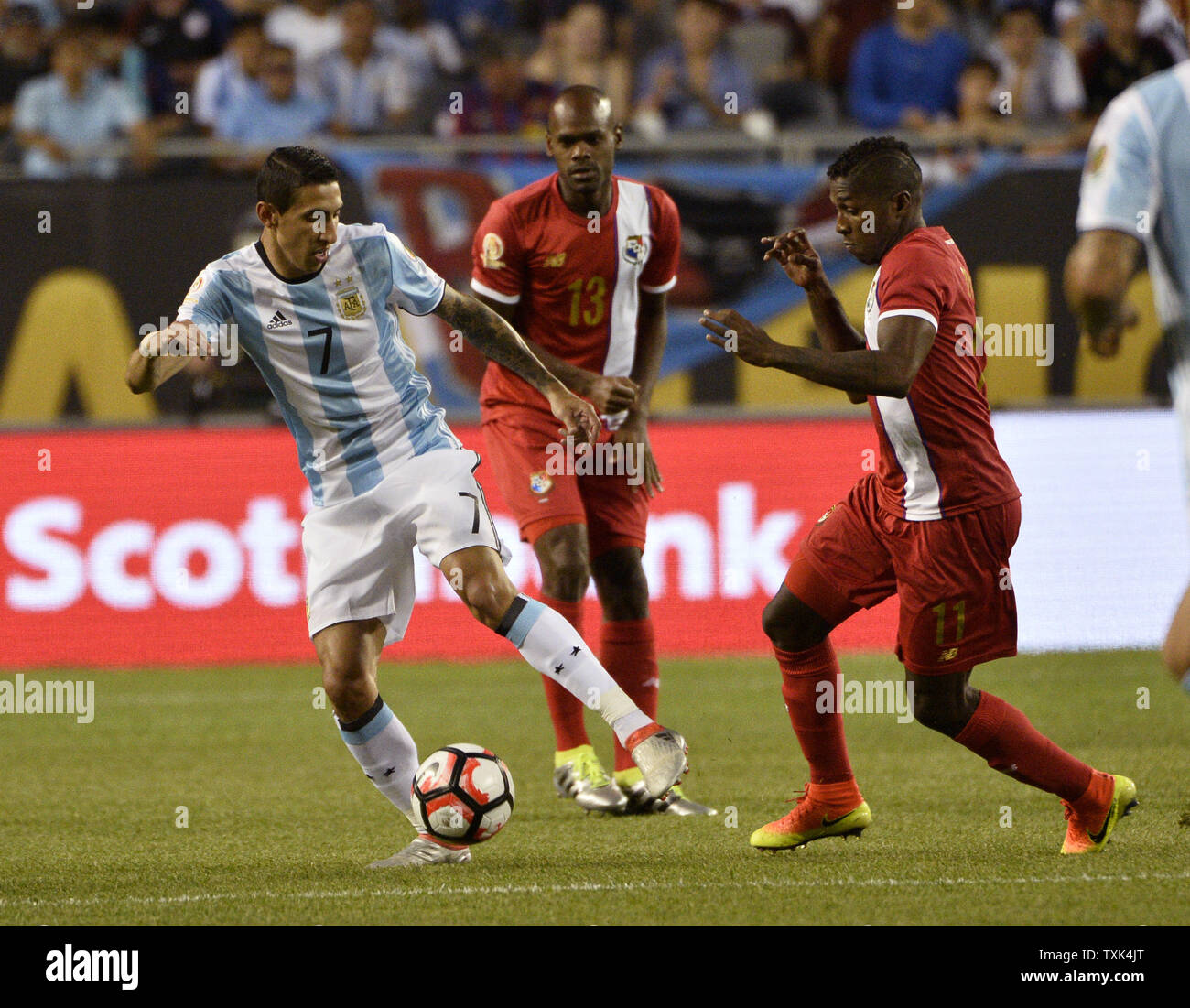 Argentina midfielder Angel Di Maria (L-R) moves the ball as Panama defender Adolfo Machado and midfielder Armando Cooper defend during the first half of a 2016 Copa America Centenario Group D match at Soldier Field in Chicago on June 10, 2016. Argentina defeated Panama 5-0.     Photo by Brian Kersey/UPI Stock Photo