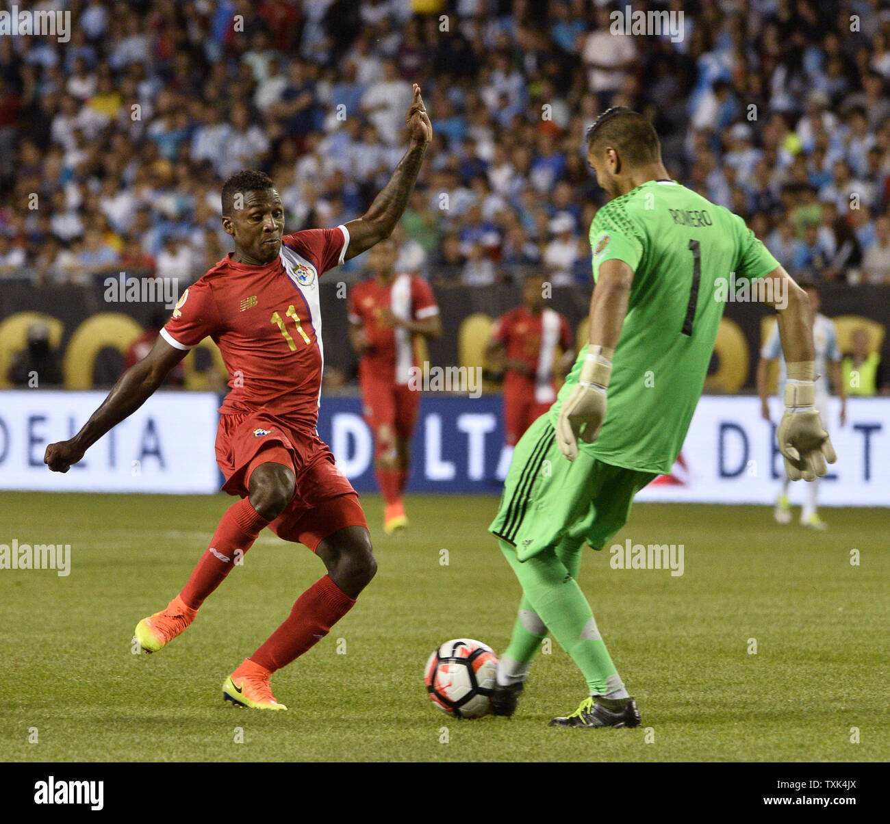 Argentina goalkeeper Sergio Romero (R) beats Panama midfielder Armando Cooper to the ball during the first half of a 2016 Copa America Centenario Group D match at Soldier Field in Chicago on June 10, 2016. Argentina defeated Panama 5-0.     Photo by Brian Kersey/UPI Stock Photo