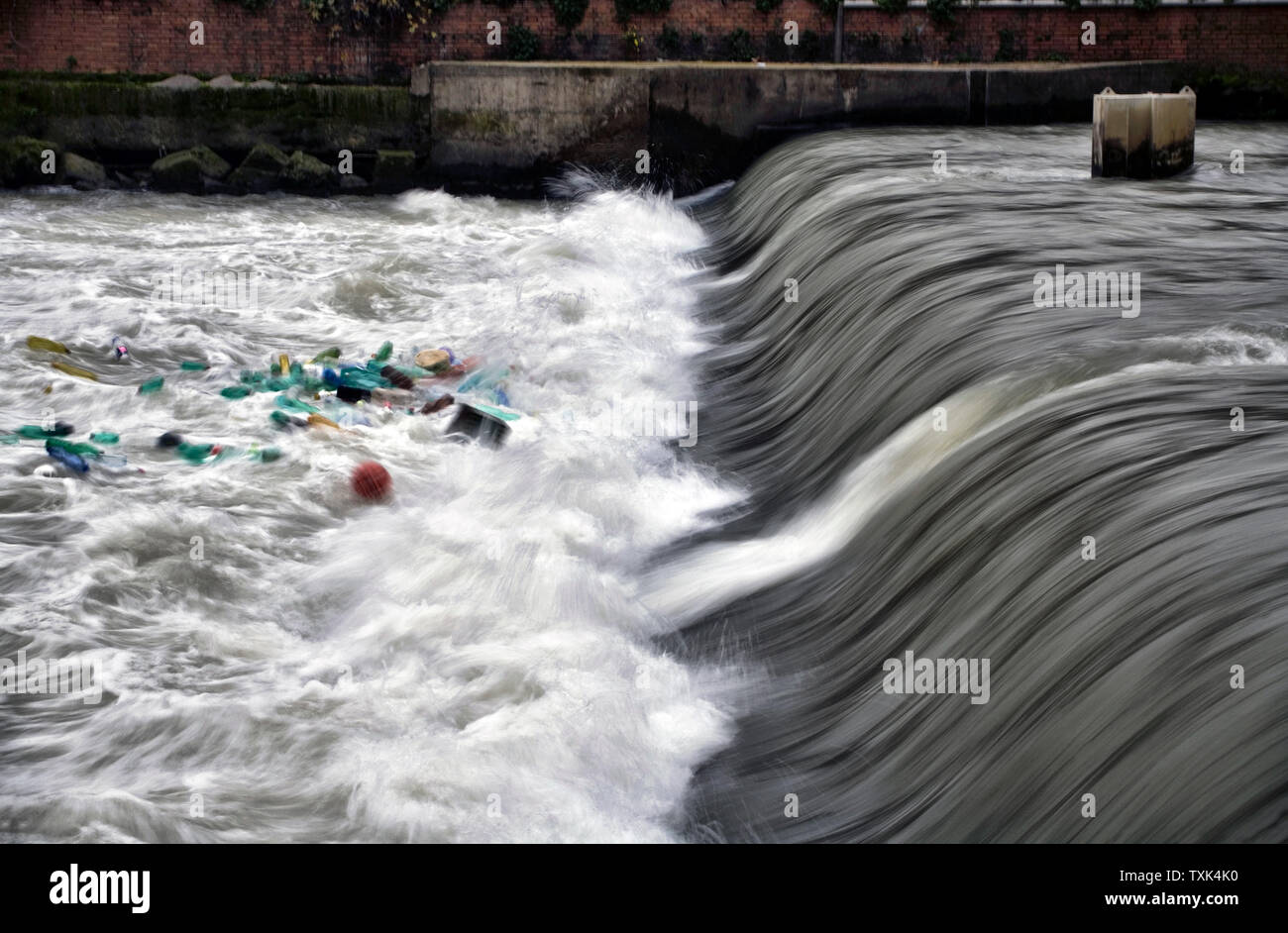 Plastic bottles and garbage floating on the River Tevere, Rome, Italy. Stock Photo