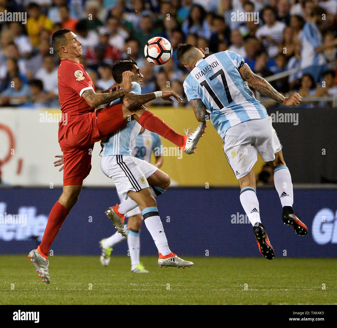 Panama forward Blas Perez (L-R), Argentina midfielder Augusto Fernandez and defender Nicolas Otamendi go for the ball during the first half of a 2016 Copa America Centenario Group D match at Soldier Field in Chicago on June 10, 2016. Argentina defeated Panama 5-0.     Photo by Brian Kersey/UPI Stock Photo