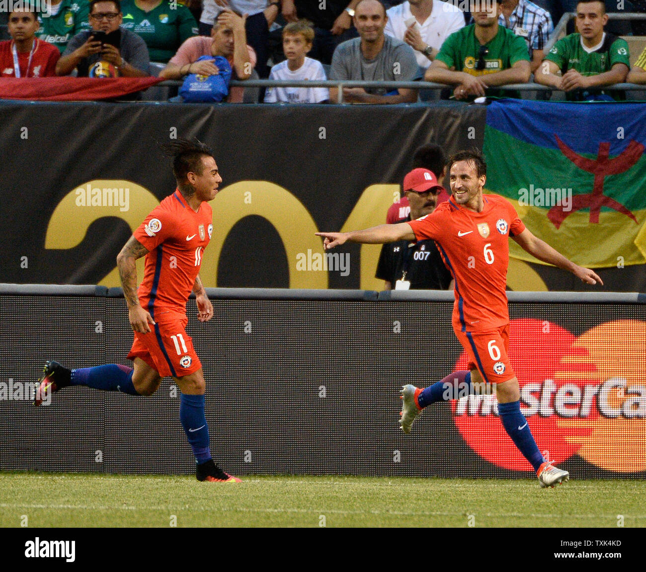 Chile forward Eduardo Vargas (L) and midfielder Jose Pedro Fuenzalida celebrate Fuenzalida's goal during the first half of a 2016 Copa America Centenario Semifinal match against Colombia at Soldier Field in Chicago on June 22, 2016.     Photo by Brian Kersey/UPI Stock Photo
