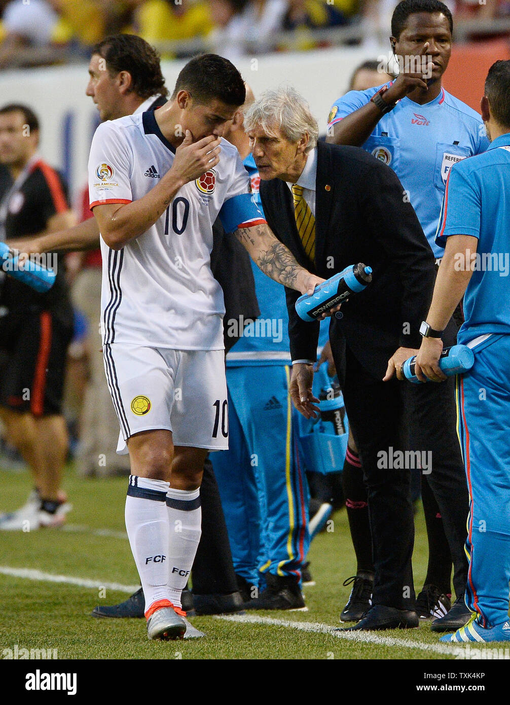 Colombia's manager Jose Pekerman (R) talks with midfielder James Rodriguez during the first half of a 2016 Copa America Centenario Semifinal match against Chile at Soldier Field in Chicago on June 22, 2016.     Photo by Brian Kersey/UPI Stock Photo