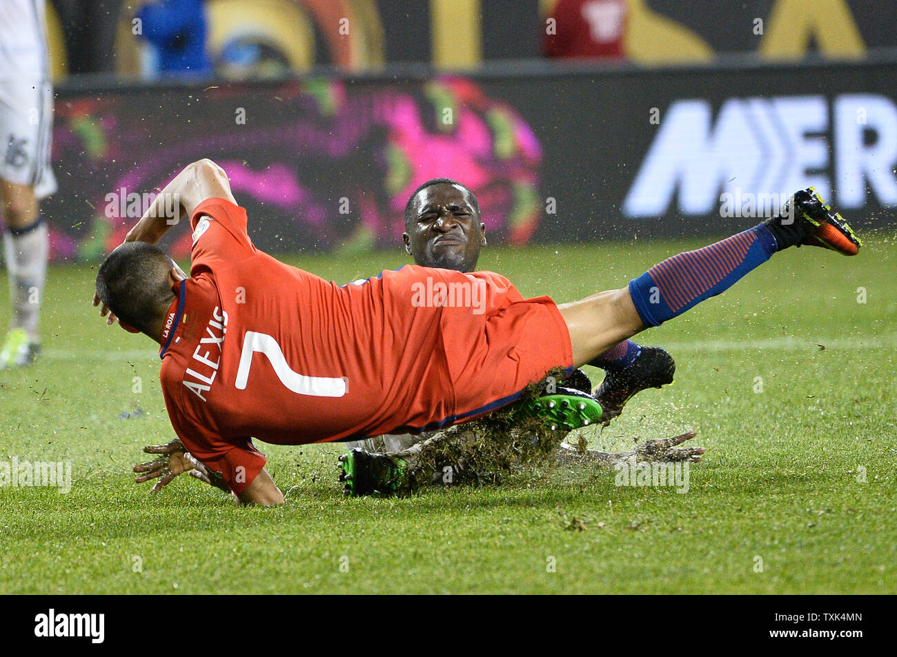 Colombia defender Cristian Zapata takes out Chile forward Alexis Sanchez (7) during the second half of a 2016 Copa America Centenario Semifinal match at Soldier Field in Chicago on June 22, 2016. Chile defeated Colombia 2-0.     Photo by Brian Kersey/UPI Stock Photo