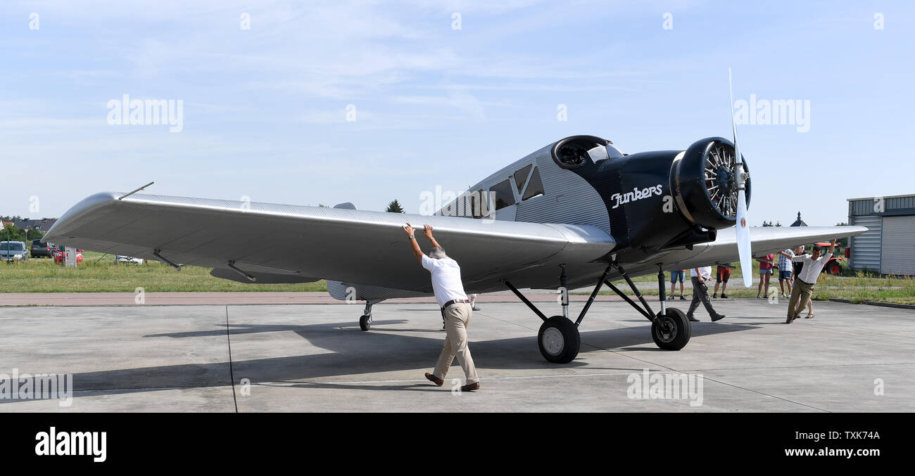 25 June 2019, Saxony-Anhalt, Dessau-Roßlau: A Junkers F 13 aircraft is refuelled at the airfield in Dessau. Exactly 100 years ago, an aircraft of this type took off for the first time in Dessau. The aircraft, designed by aircraft pioneer Hugo Junkers, was the world's first all-metal commercial aircraft and is regarded as a pioneer in civil aviation. Since 2016, the machine has again been manufactured in small series in Switzerland. Photo: Hendrik Schmidt/dpa-Zentralbild/dpa Stock Photo