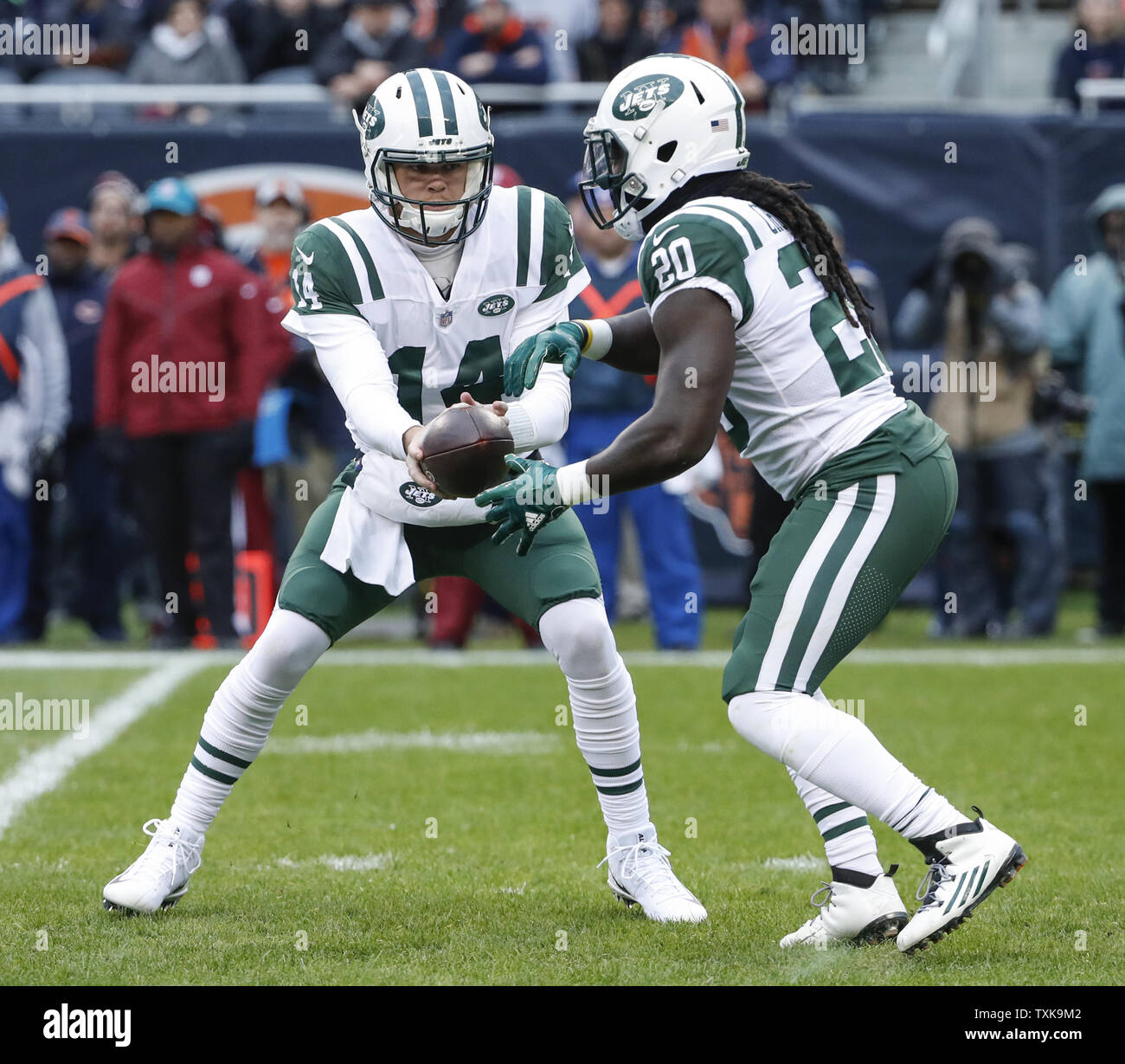 New York Jets quarterback Sam Darnold (14) passes the ball to running back Isaiah Crowell (20) against the Chicago Bears during the first half at Soldier Field in Chicago on October 28, 2018. Photo by Kamil Krzaczynski/UPI Stock Photo