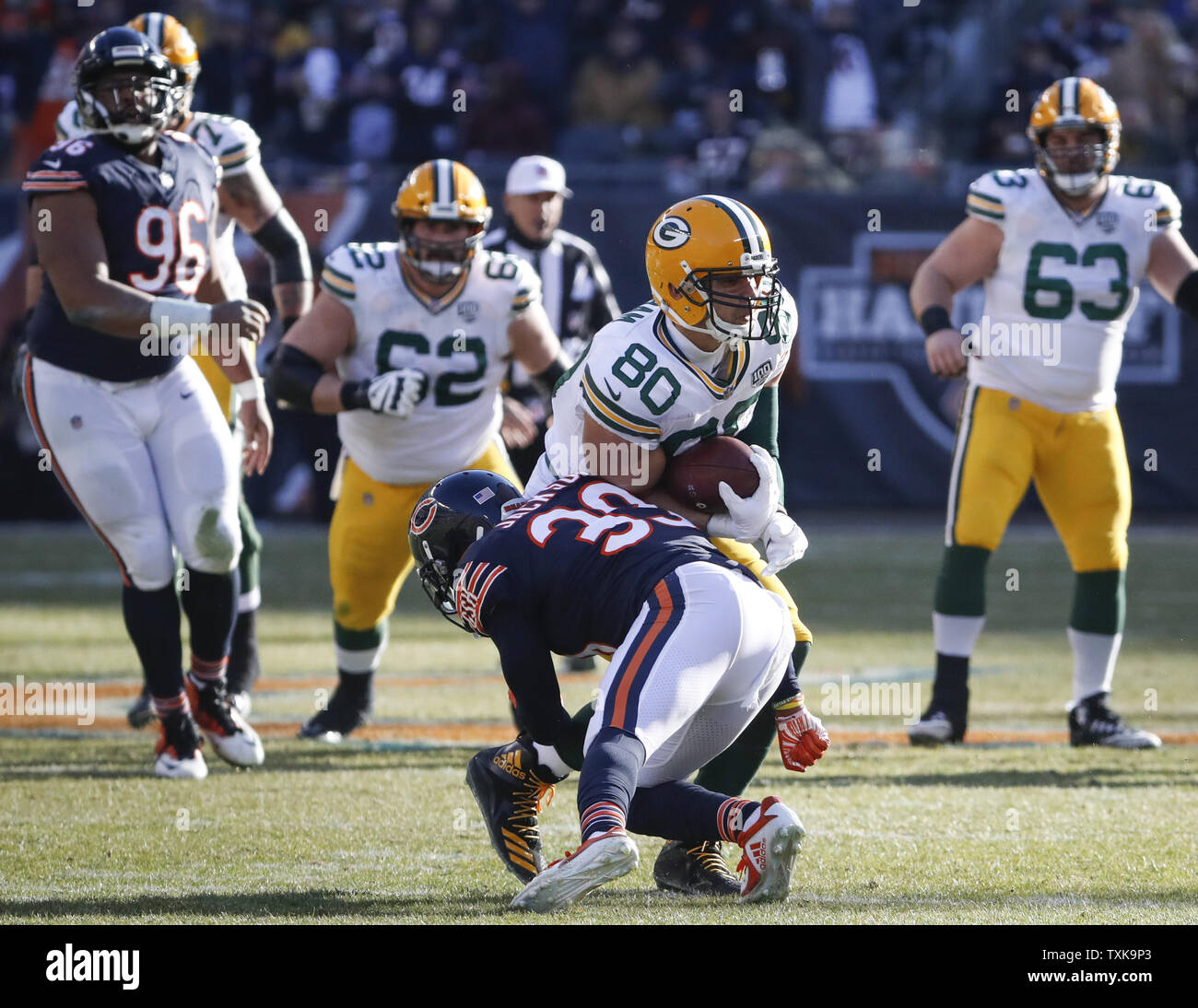 Chicago Bears free safety Eddie Jackson (39) tackles Green Bay Packers tight end Jimmy Graham (80) during the second half at Soldier Field in Chicago on December 16, 2018. Photo by Kamil Krzaczynski/UPI Stock Photo