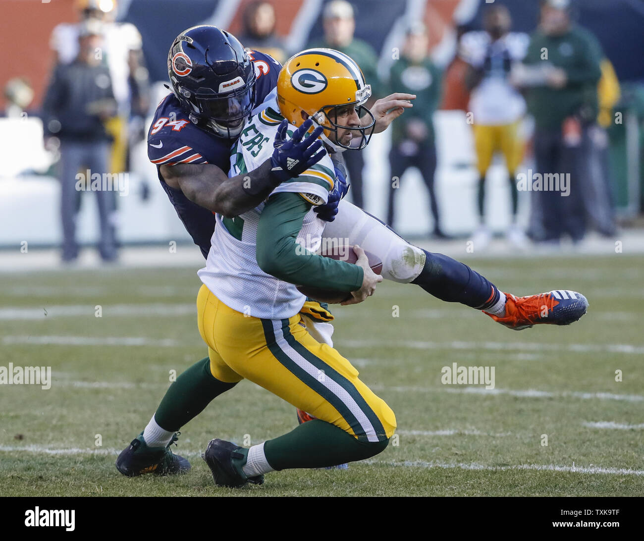 Chicago Bears outside linebacker Leonard Floyd (94) tackles Green Bay Packers quarterback Aaron Rodgers (12) during the second half at Soldier Field in Chicago on December 16, 2018. Photo by Kamil Krzaczynski/UPI Stock Photo