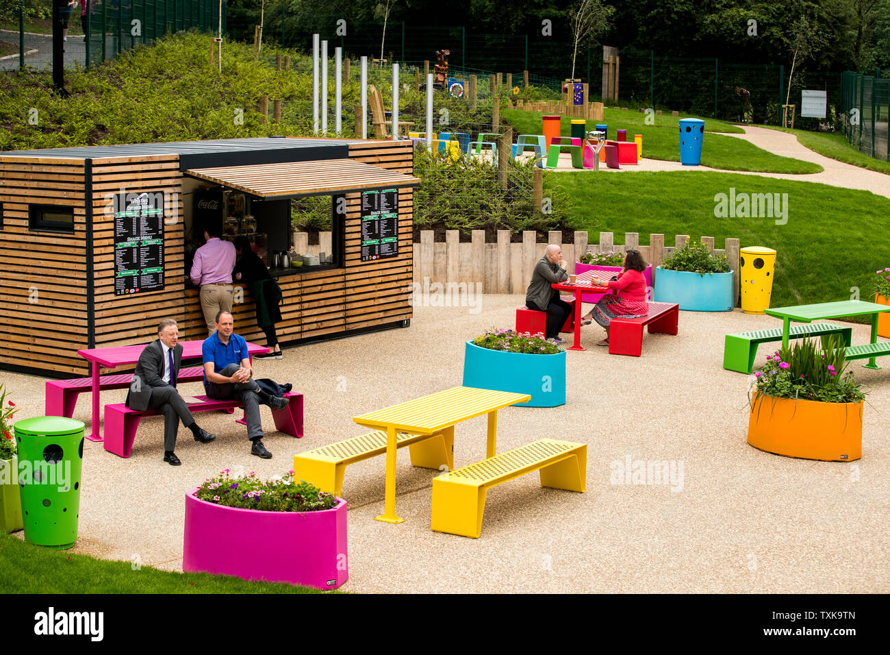 People relax in the Whistles The Park coffee bar during the reopening