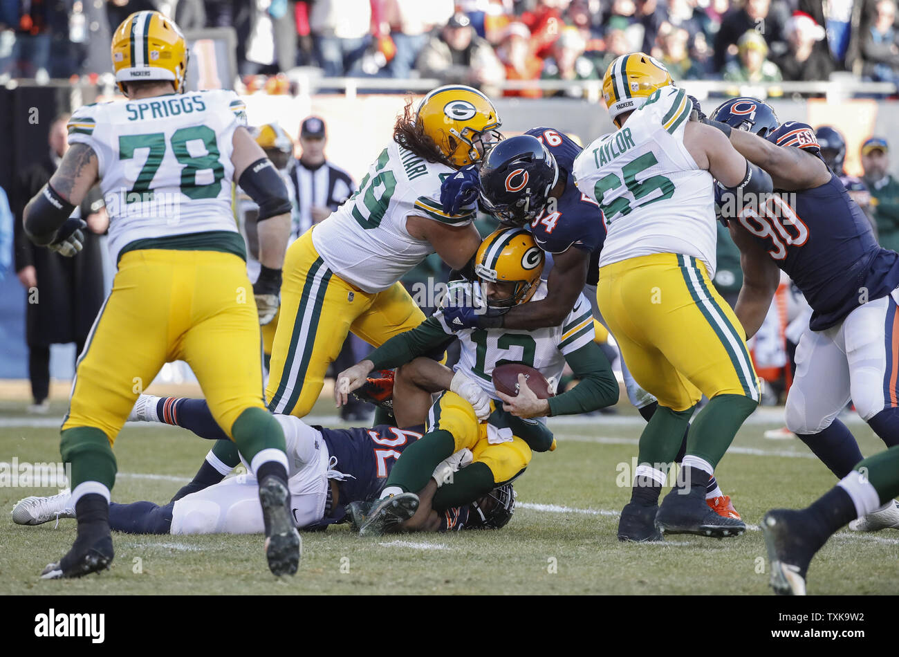 Green Bay Packers quarterback Aaron Rodgers (12) is sacked by Chicago Bears outside linebacker Khalil Mack (52) during the second half at Soldier Field in Chicago on December 16, 2018. Photo by Kamil Krzaczynski/UPI Stock Photo