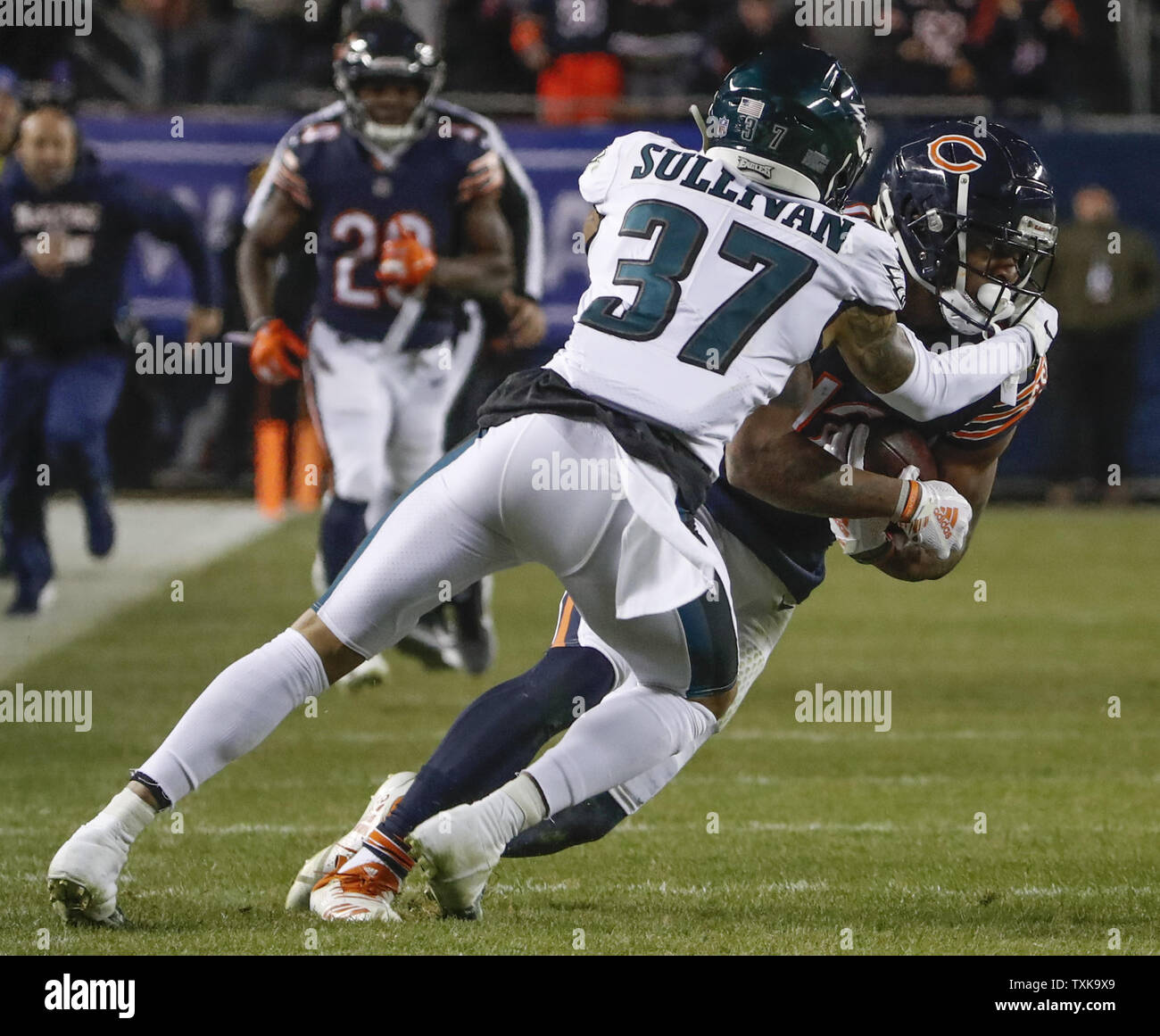 Chicago Bears defensive back Tre Roberson, left, scores a touchdown after  intercepting a pass against the Tennessee Titans in the first half of a  preseason NFL football game Saturday, Aug. 28, 2021