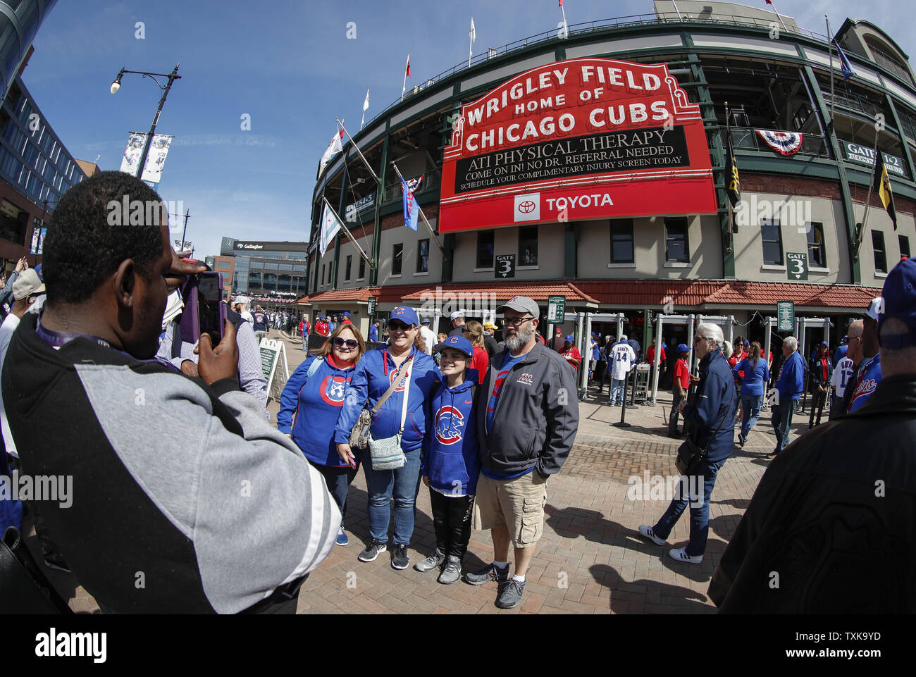 Fans pose for a picture before the Chicago Cubs home opener against Pittsburgh Pirates outside of Wrigley Field on April 8, 2019 in Chicago. Photo by Kamil Krzaczynski/UPI Stock Photo