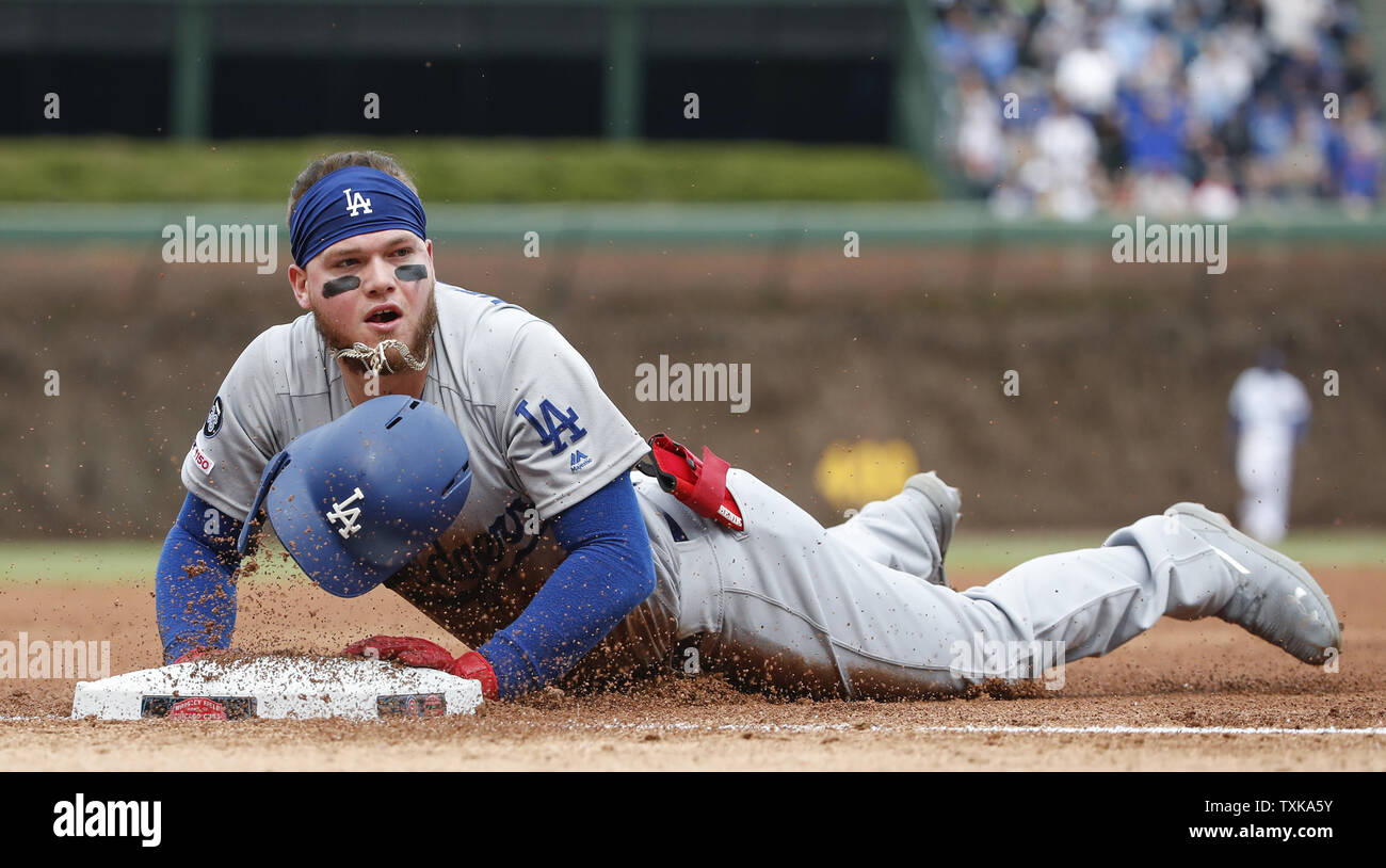 Los Angeles Dodgers center fielder Alex Verdugo slides into third base after hitting a triple against the Chicago Cubs in the fifth inning at Wrigley Field on April 25, 2019 in Chicago. Photo by Kamil Krzaczynski/UPI Stock Photo