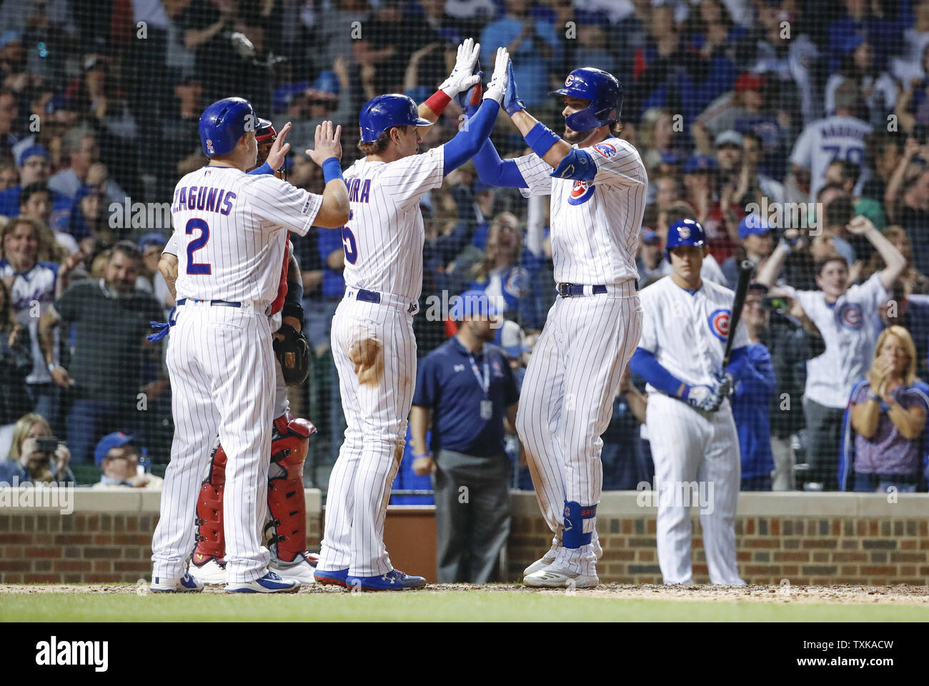 Chicago Cubs' Kris Bryant (R) celebrates with Albert Almora Jr. (C) and Mark Zagunis (L) after hitting a grand slam off of St. Louis Cardinals relief pitcher Dominic Leone in the eight inning at Wrigley Field on May 5, 2019 in Chicago. Photo by Kamil Krzaczynski/UPI Stock Photo